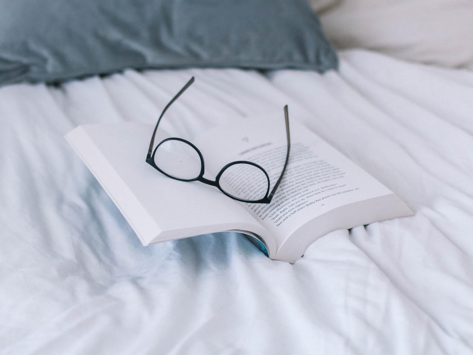A book and eyeglasses
