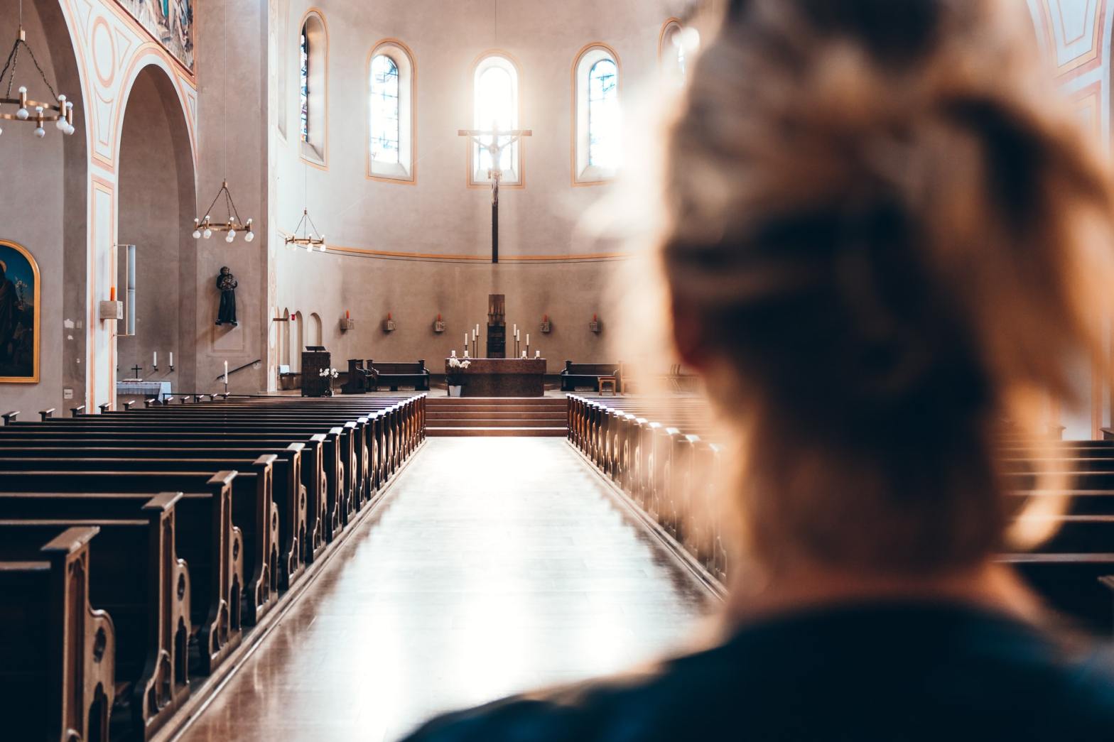 A woman facing the altar