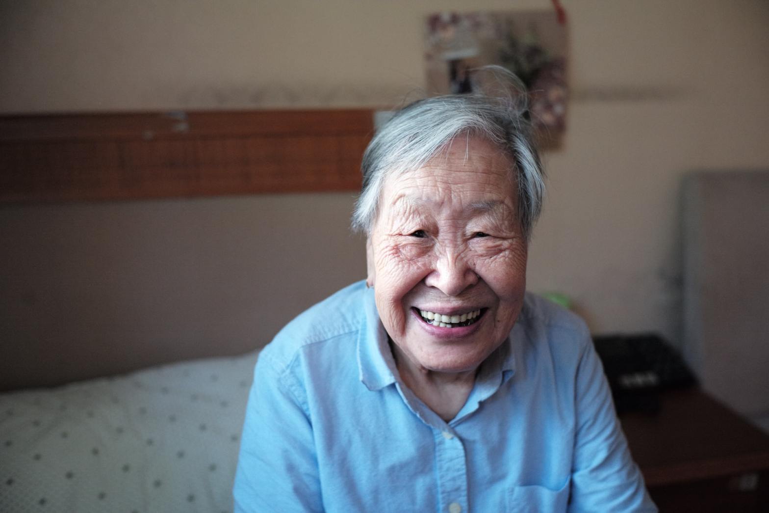 A smiling elderly woman
