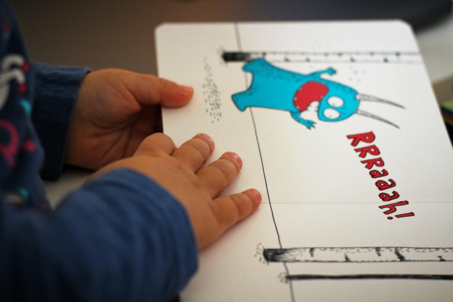 picture book with a kid's hands