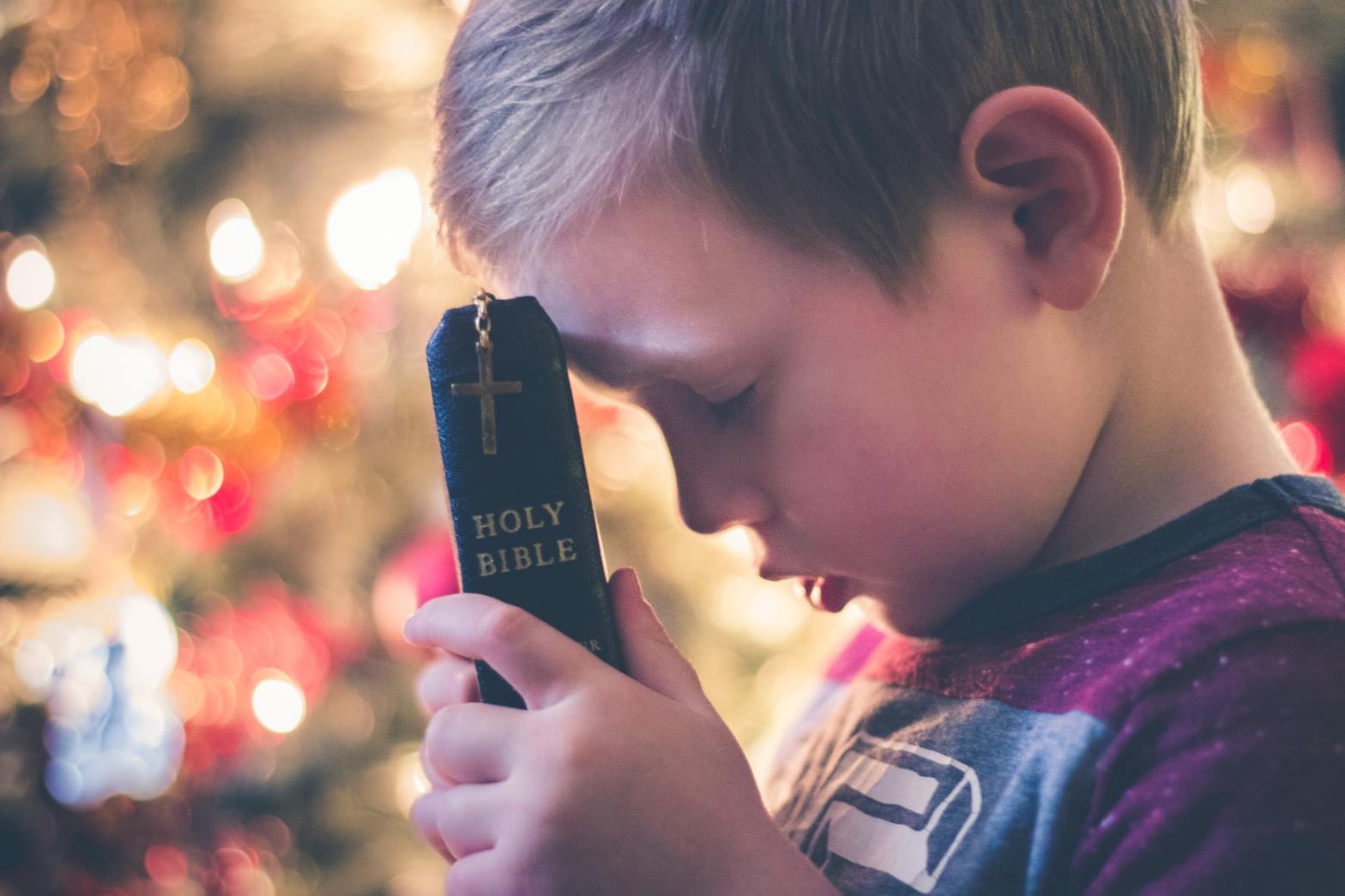 A child holding a bible