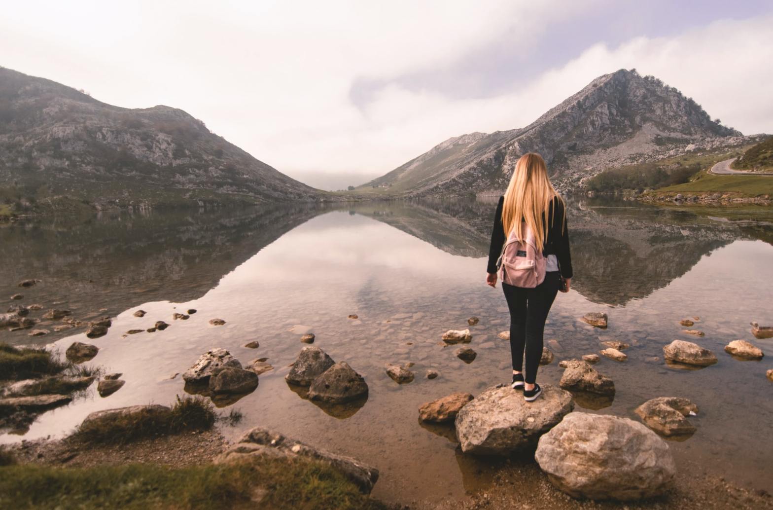 A woman standing on a rock