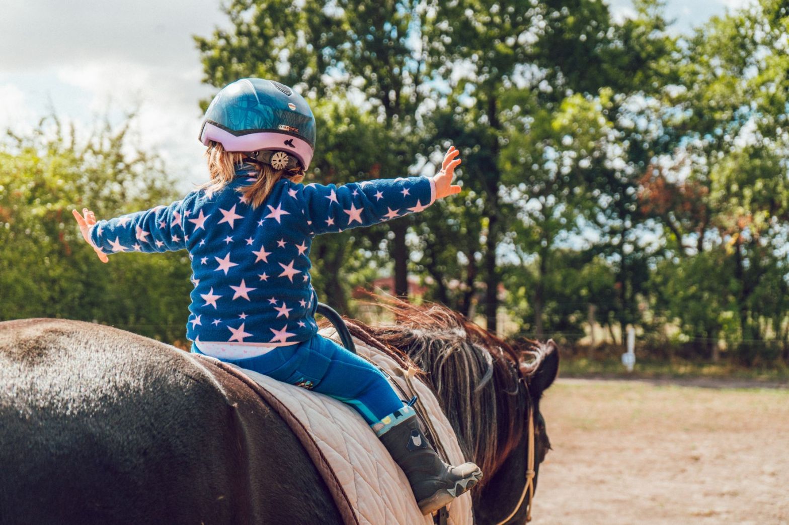 kid riding a horse