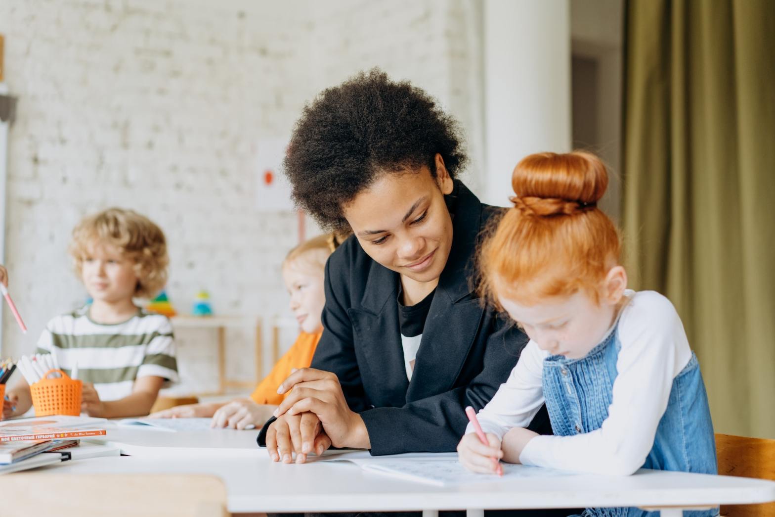 woman teaching child to write tips to teach students poetry