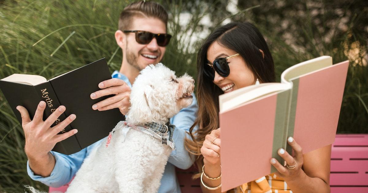couple reading books with dog reasons why poetry is good