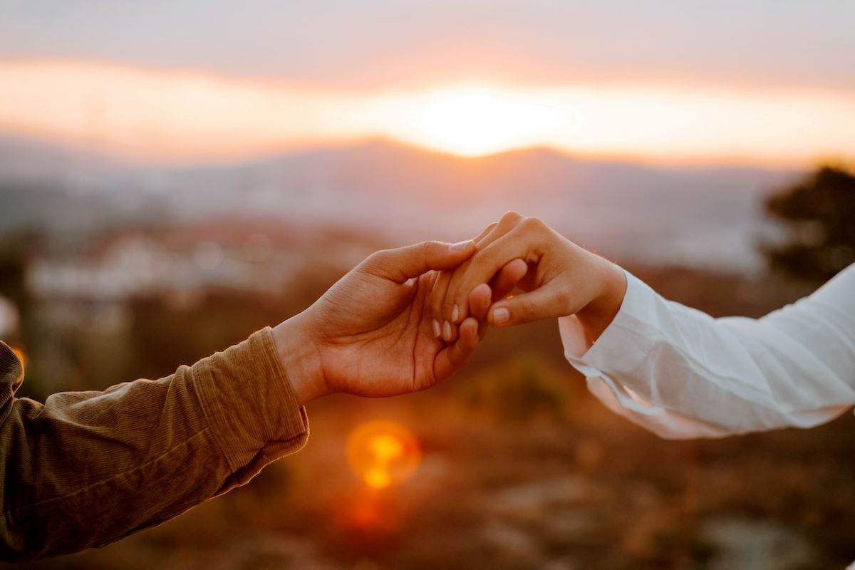 holding hands on sunset types of love language